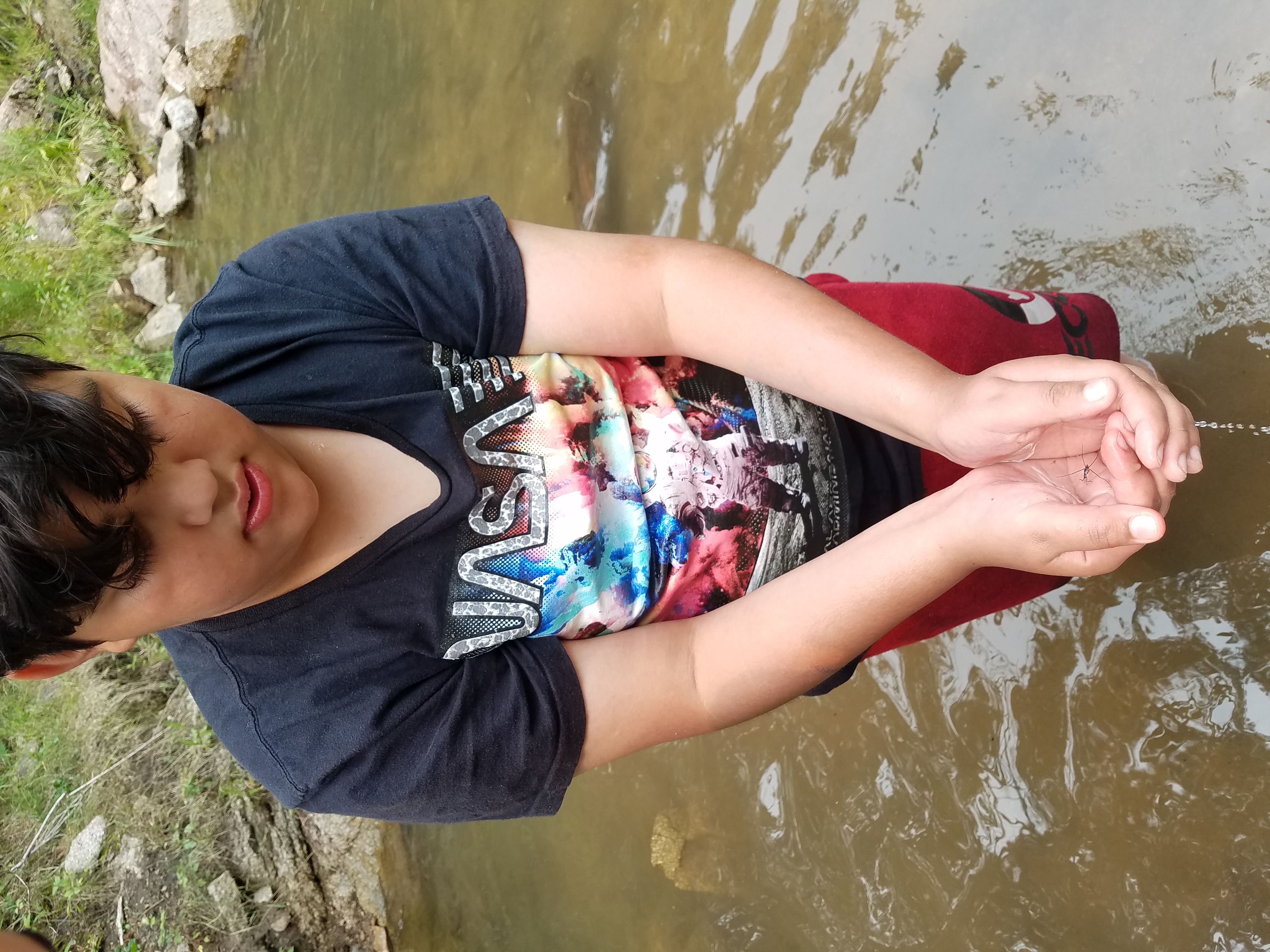 Student holding a water bug!