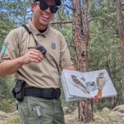 Ranger Barrientos shows off his nature journal