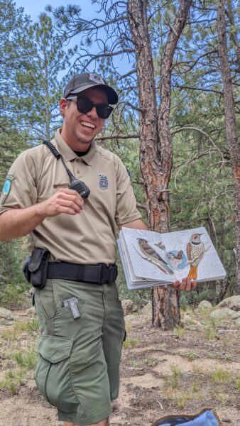 Ranger Barrientos shows off his nature journal
