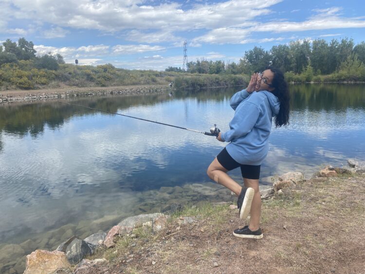 A student fishing at Lake Lehow