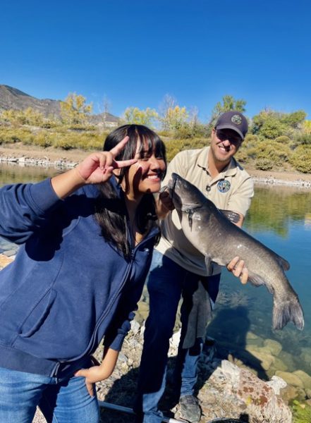 A STRIVE student catching a fish at Lake Lehow!