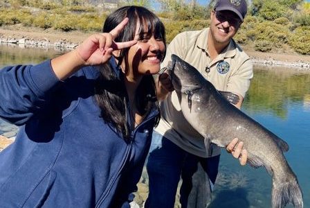 A STRIVE student catching a fish at Lake Lehow!