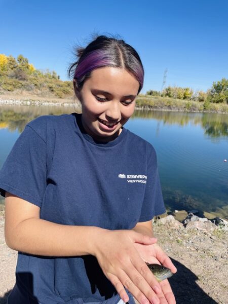 A student catching a fish at Lake Lehow!