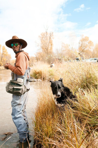 Eeland Stribling with his dog on the river