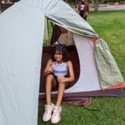 A Centaurus high school student sets up a tent in the school yard