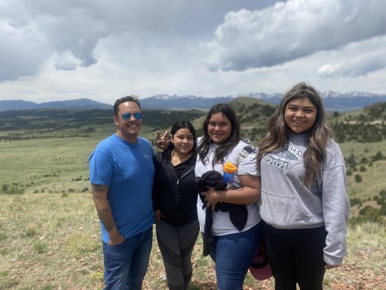 DMLK students posing at the top of a hill