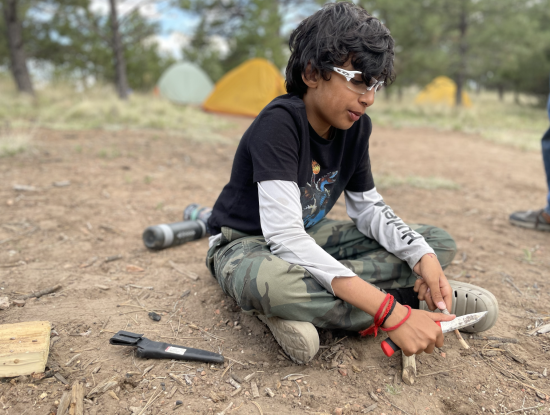 A student whittles