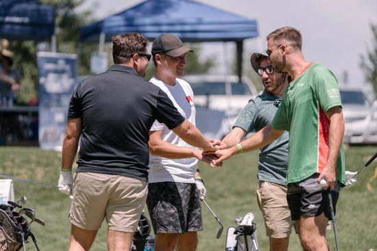 A team celebrates at Harvard Gulch 