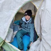 Centaurus High School student in a tent