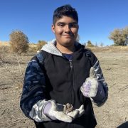 AXL student picking up trash