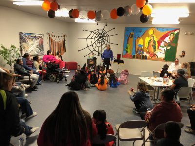 The Casa de la Esperanza community gathers for a Halloween celebration