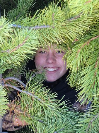 A student hiding amongst the trees like a mischievous wood elf!