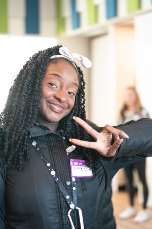 A student poses at the Outdoor and Environmental Opportunity Fair