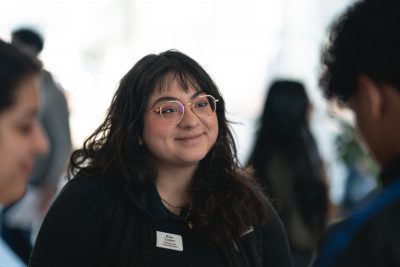 A student absorbs information at the Outdoor and Environmental Opportunity Fair