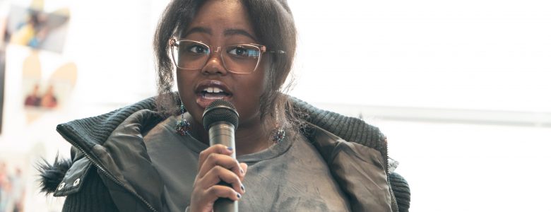 A student speaks at the Outdoor and Environmental Opportunity Fair