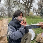 A Changemaker student practices ancestral skills at the ancestral skills gathering at Ollin Farms