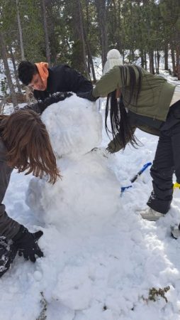 Dany, Misheel, and Leo constructing a snowman. Photo courtesy of Ms. Llager, CLDE teacher.