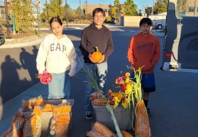 LEO program participants pose for a photo with the bounty from their day of harvesting.