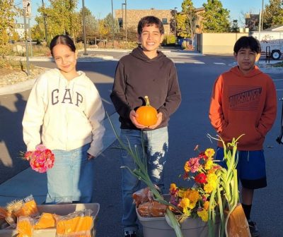 Cottonwood Institute program participants display produce they picked at a local farm.