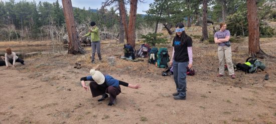 Cottonwood Alumni enjoy games after building beaver dam analogs at Caribou Ranch.