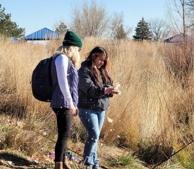 Lafayette Explore Outside participants explore interesting natural materials they find at Golden Ponds during their fishing and birding program.