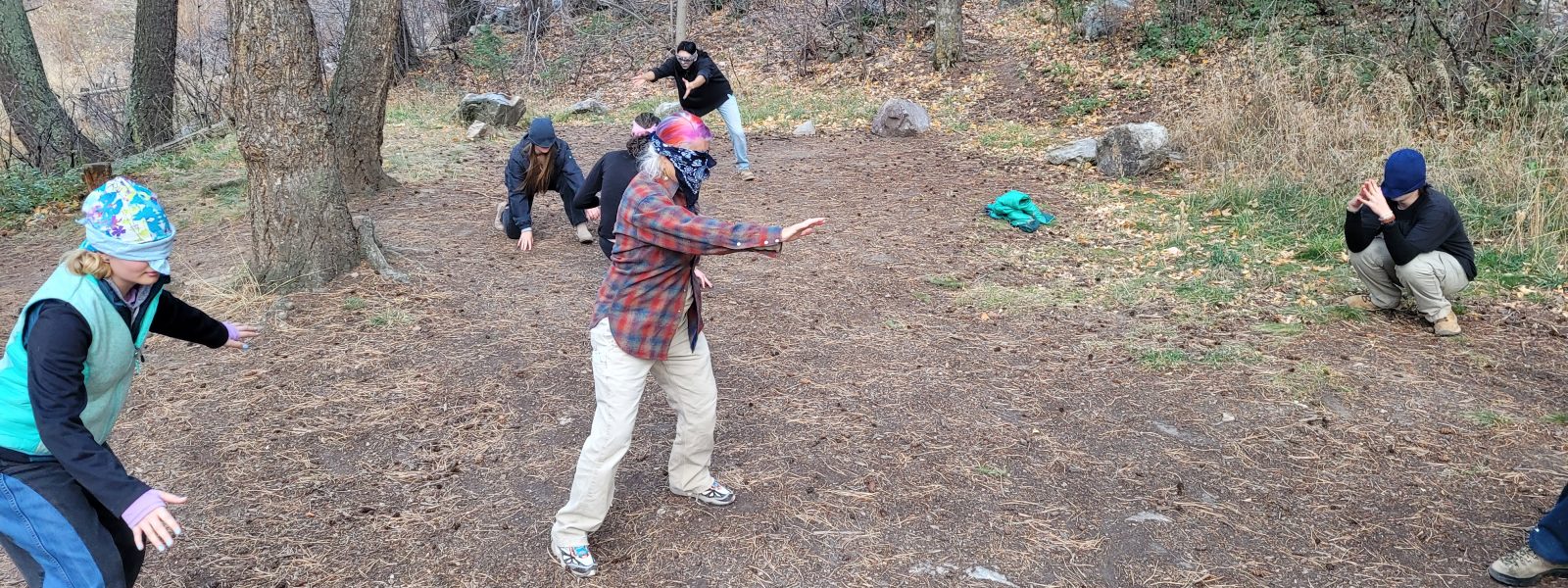 Cottonwood alumni enjoy playing games outdoors while blindfolded during their Opt Outside hiking adventure.