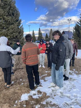 Apex students play a game with rope outside of the cabins at Snow Mountain Ranch.