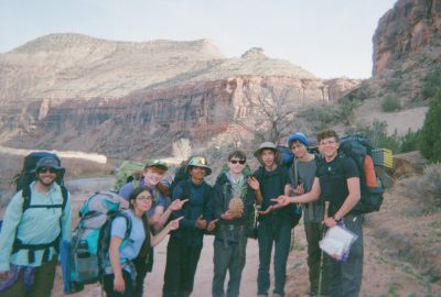 Students pose with the rare "rockfruit" they found on their canyon backpacking trip.