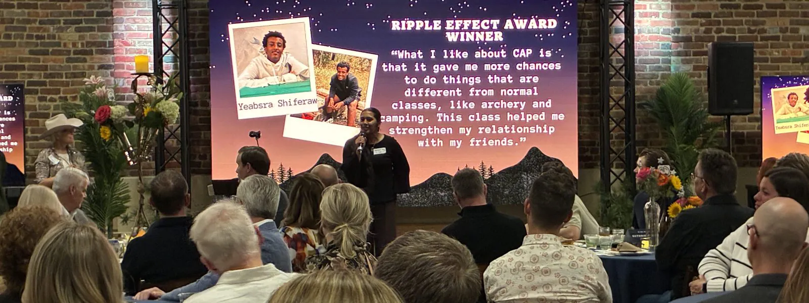 At the Bash 2026, one CAP Instructor presents the Ripple Effect Award to her student.