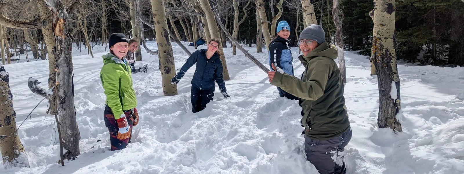 Changemakers play in deep snow on their overnight trip where they built and slept in quinzees.