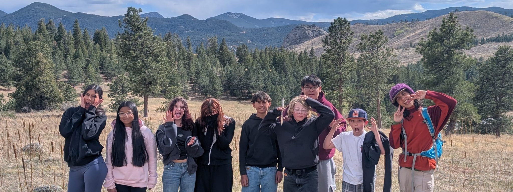 Angevine students enjoy making funny faces as they pose near their campsite.