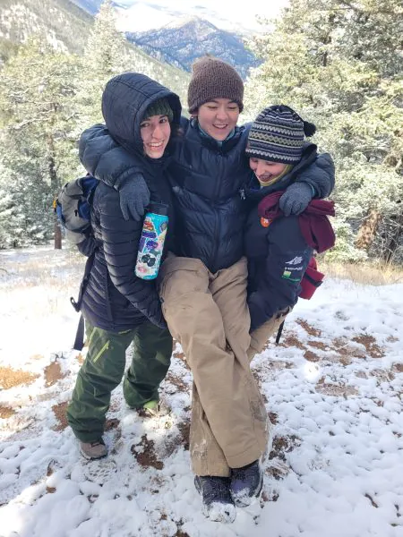 Iona Kelly, who is showcasing student leadership, is picked up by two other Cottonwood Alumni on their snowy spring break hike.