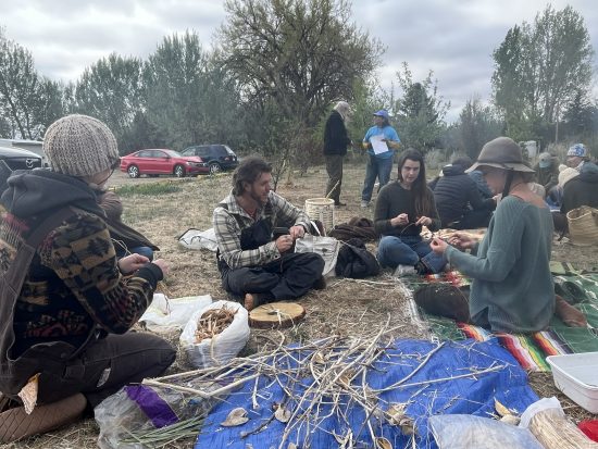 Participants at the Cottonwood Ancestral Skills Gathering 2026 learn how to make cordage.