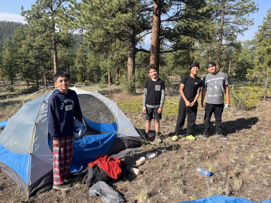 Horizons student show off the tent that they set up, some of them for their first-time camping.
