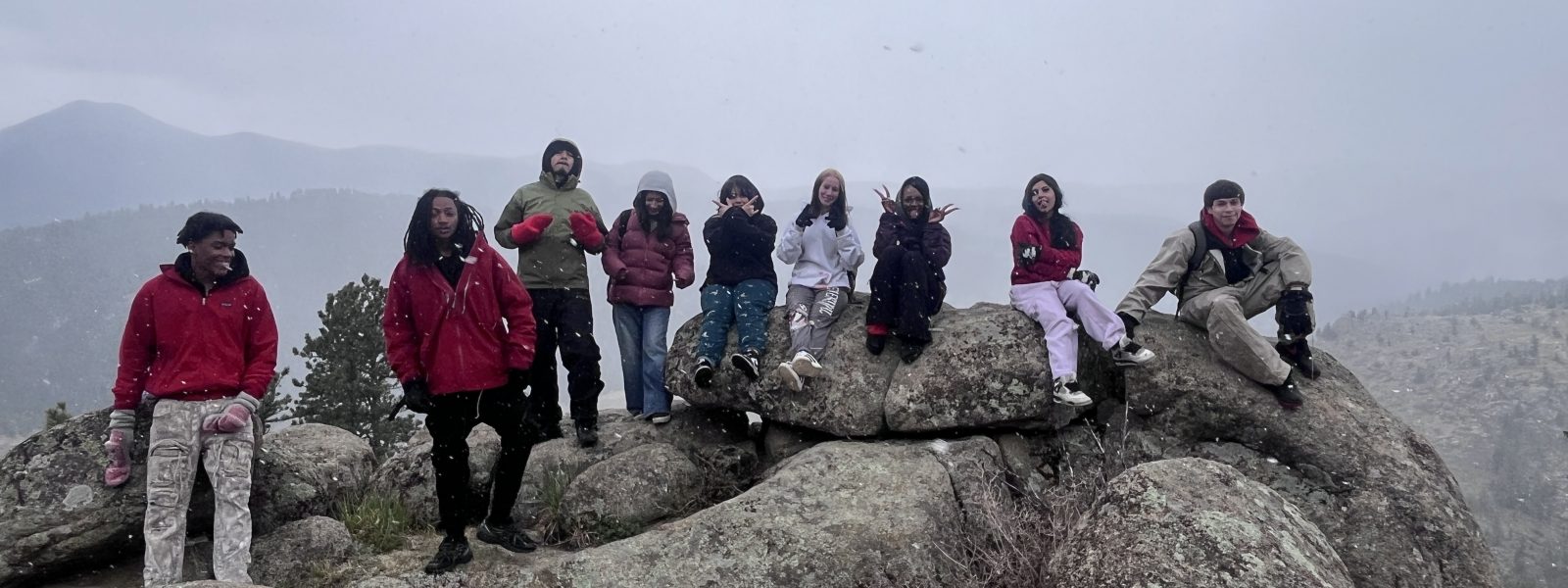 CHSC students felt a sense of wonder as they posed at the top of a hike with a view of the surrounding mountains shrouded in fog.