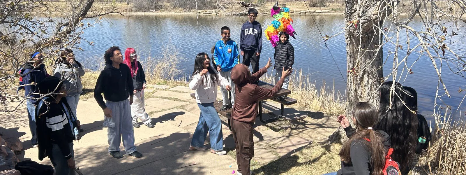 AXL students enjoy trying to hit a pinata during one of their outdoor adventures.