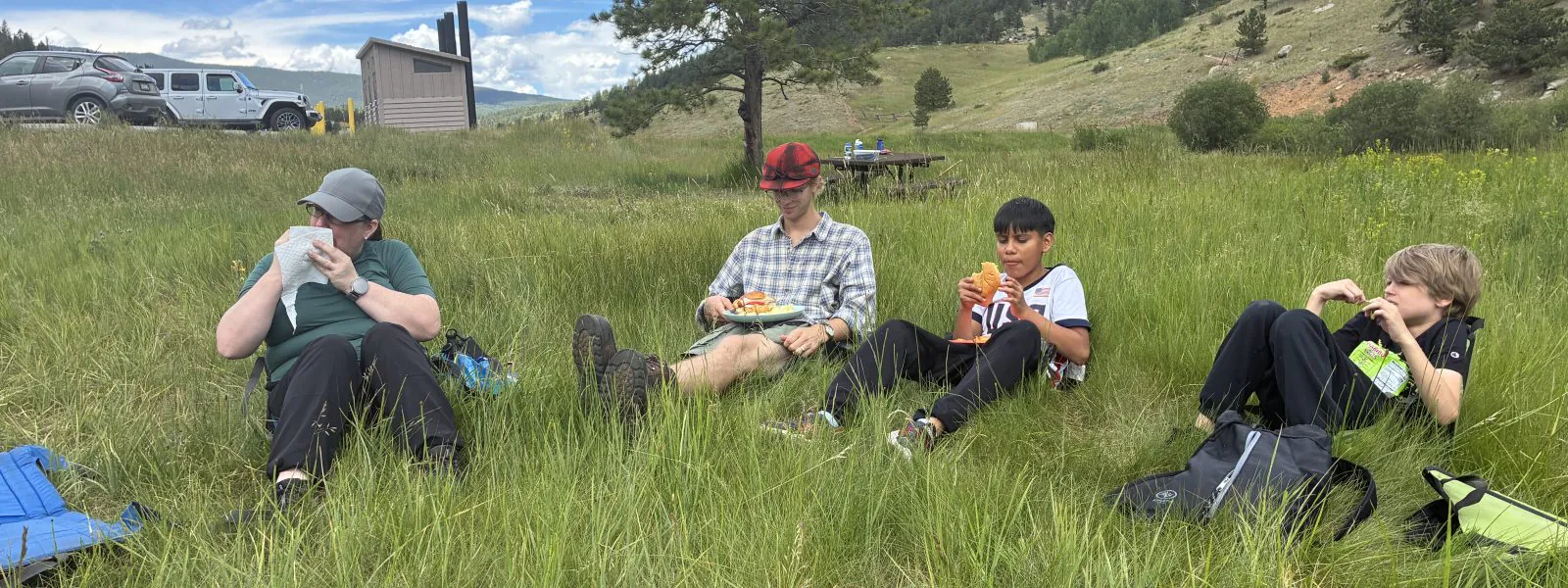 LYC students enjoy lunch outdoors on the camping trip at Golden Gate Canyon State Park.