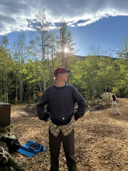 Cooper, the Cottonwood Rookies of the Year who transitioned from participant to instructor over the years, shows off his outdoor style at a campsite.