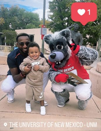Board member D'Andre poses with his son and the Univ of New Mexico mascot.
