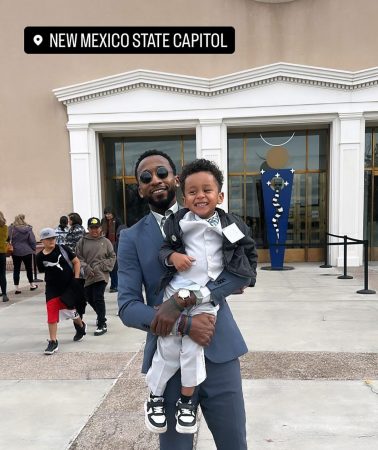 Board member D'Andre poses with his son at the New Mexico State Capitol.