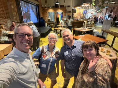 Cottonwood staff and supporters smile for a photo during the community networking event in September at Woods Boss.