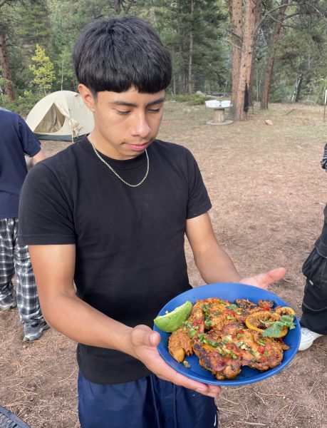 One student displays a beautifully arranged plate of chicken during the Staunton camping trip.
